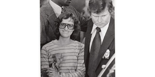 Patty Hearst being moved after arrest.