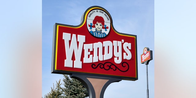 "Clio, Michigan, USA - March 7, 2012: The Wendy's location in Clio, Michigan. Founded in 1969 by Dave Thomas, Wendy's is a chain of fast food restaurants with over 6,600 locations in the US and abroad."