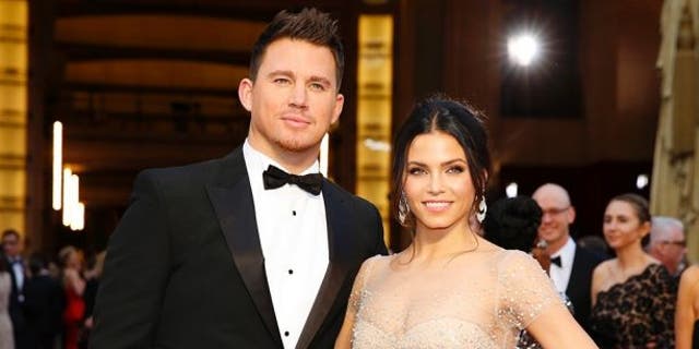 Channing Tatum and Jenna Dewan arrive on the red carpet at the 86th Academy Awards in Hollywood, California March 2, 2014.