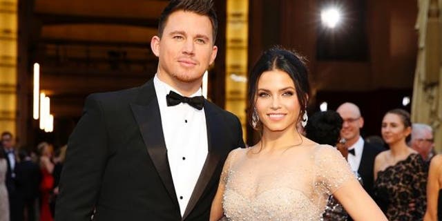 Channing Tatum and Jenna Dewan arrive on the red carpet at the 86th Academy Awards in Hollywood, California March 2, 2014.