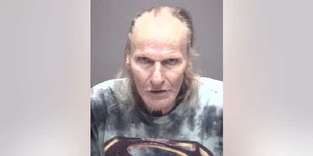 Johnny Manning, 72, was arrested after allegedly using a lawnmower to hurl rocks at three people, police said.