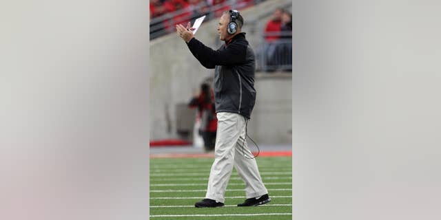 Rutgers head coach Kyle Flood instructs his team against Ohio State during the second quarter of an NCAA college football game Saturday, Oct. 18, 2014, in Columbus, Ohio. Ohio State won 56-17. (AP Photo/Jay LaPrete)