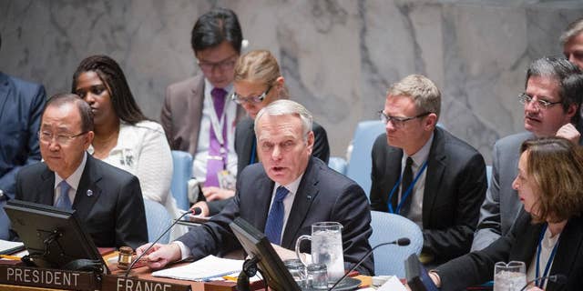 In this photo provided by the United Nations, Jean-Marc Ayrault, center, Minister for Foreign Affairs and International Development of France, addresses the United Nations Security Council, Friday, June 10, 2016 at United Nations headquarters. U.N. Secretary-General Ban Ki-moon is seated to his left and Hasmik Egian, Acting Director of the Security Council Affairs Division, is to the right. Ayrault addressed a small group of reporters on Friday, warning that Israel's ban on Palestinians entering its territory following the "abominable" attack on a popular cafe in Tel Aviv could escalate violence instead of focus attention on the need to pursue peace. (Rick Bajornas/The United Nations via AP)
