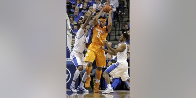 FILE - In htis Jan. 18, 2014, file photo, Tennessee's Jarnell Stokes (5) is pressured by Kentucky's James Young, left, and Andrew Harrison during the second half of an NCAA college basketball game in Lexington, Ky. Stokes' 20-point, 15-rebound outing Saturday in a 74-66 loss at Kentucky showed he's capable of delivering dominant efforts. (AP Photo/James Crisp, File)