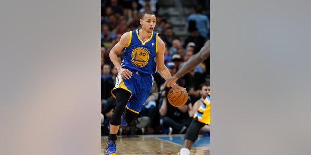 Golden State Warriors guard Stephen Curry picks up a loose ball against the Denver Nuggets in the first quarter of Game 2 of the teams' NBA first-round playoff series in Denver on Tuesday, April 23, 2013. (AP Photo/David Zalubowski)