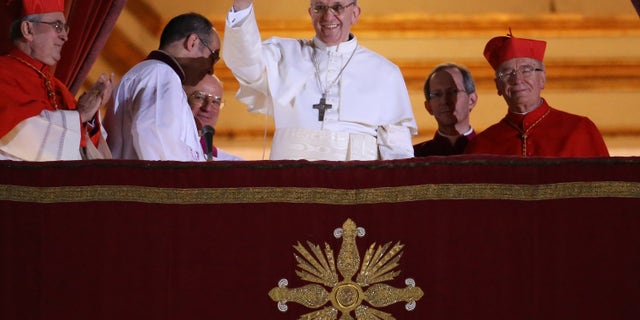 VATICAN CITY, VATICAN - MARCH 13: Newly elected Pope Francis I waves to the waiting crowd from the central balcony of St Peter's Basilica on March 13, 2013 in Vatican City, Vatican. Argentinian Cardinal Jorge Mario Bergoglio was elected as the 266th Pontiff and will lead the world's 1.2 billion Catholics. (Photo by Peter Macdiarmid/Getty Images)