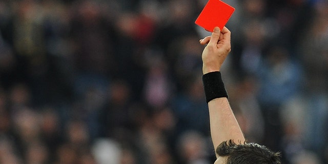 TURIN, ITALY - APRIL 06: Giuseppe Rizzo (C) of Pescara receives the red card from referee Sebastiano Peruzzo during the Serie A match between Juventus and Pescara at Juventus Arena on April 6, 2013 in Turin, Italy. (Photo by Valerio Pennicino/Getty Images)