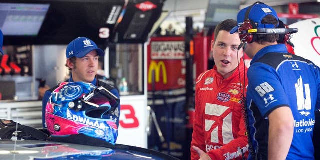 Alex Bowman, center, smiles as he talks with the crew of Dale Earnhardt Jr. before practice Friday July 15, 2016 at New Hampshire Motor Speedway in Loudon, N.H. Bowman will take Earnhardt's place for Sunday's New Hampshire 301 auto race after it was announced that Earnhardt will miss the race due to concussion-like symptoms. (AP Photo/Jim Cole)