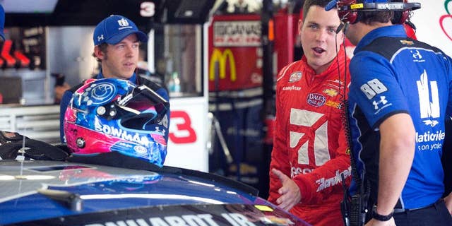 Alex Bowman, center, smiles as he talks with the crew of Dale Earnhardt Jr. before practice Friday July 15, 2016 at New Hampshire Motor Speedway in Loudon, N.H. Bowman will take Earnhardt's place for Sunday's New Hampshire 301 auto race after it was announced that Earnhardt will miss the race due to concussion-like symptoms. (AP Photo/Jim Cole)