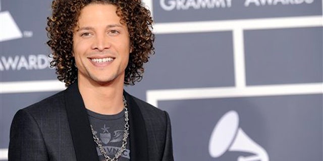 Justin Guarini arrives at the Grammy Awards on Sunday, Jan. 31, 2010, in Los Angeles. (AP Photo/Chris Pizzello)