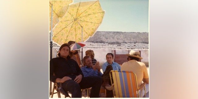 Johnny Cash, Kirk Douglas and Saul Holiff on the set of the 1971 film "A Gunfight".