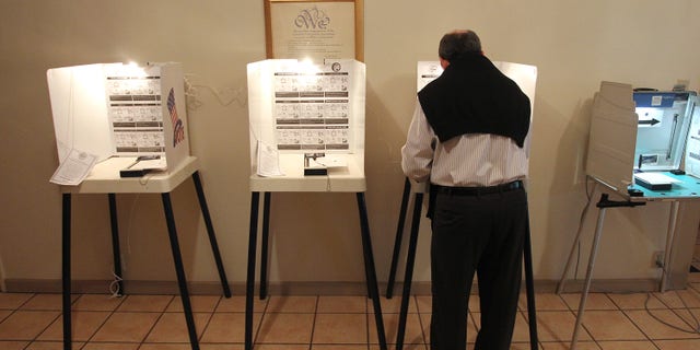 LOS ANGELES, CA - MAY 21: A man marks his ballot in an election that is expected to have very low voter turnout for the race between Los Angeles City Controller Wendy Greuel and Councilman Eric Garcetti for Los Angeles mayor on May 21, 2013 in Los Angeles, California. Greuel could become the first-ever woman mayor of Los Angeles in her bid to replace two-time mayor Antonio Villaraigosa. (Photo by David McNew/Getty Images)