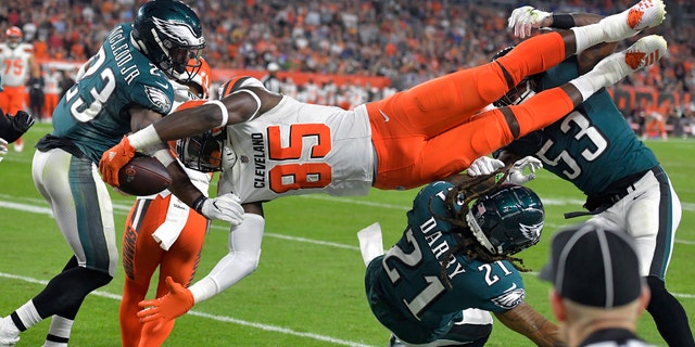 Cleveland Browns tight end David Njoku (85) is up-ended during the first half of an NFL preseason football game against the Philadelphia Eagles, Thursday, Aug. 23, 2018, in Cleveland.