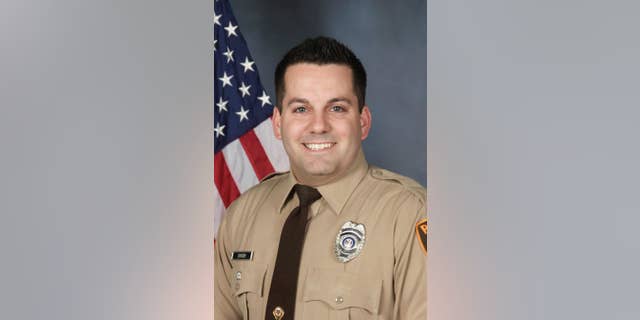 An undated photo provided by the St. Louis County Police Department shows St. Louis County Police officer Blake Snyder. Police say 33-year-old white officer Blake Snyder was fatally wounded during a pre-dawn shooting Thursday, Oct. 6, 2016, in Green Park, Mo., a small middle-class community. Police say the suspect, an 18-year-old white male, is in critical but stable condition after being shot by another officer. (St. Louis County Police Department via AP)