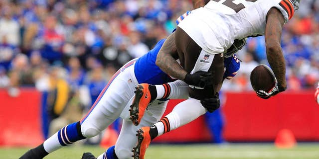 Cleveland Browns wide receiver Josh Gordon, right, is hit by Buffalo Bills middle linebacker Brandon Spike during the first half of an NFL football game, Sunday, Nov. 30, 2014, in Orchard Park, N.J. (AP Photo/Bill Wippert)