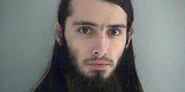 FILE - This Wednesday Jan. 14, 2015 file photo made available by the Butler County Jail shows Christopher Lee Cornell. U.S. District Judge Sandra Beckwith agreed Wednesday, April 1, 2015, to push back deadlines in the "unusual and complex" case of of Christopher Lee Cornell, an Ohio man accused of plotting to attack the U.S. Capitol. Beckwith postponed pretrial filing deadlines from April 10 to May 29 in the case of Cornell. Federal prosecutors had requested the delay, and Cornell?'s attorneys did not object. (AP Photo/Butler County Jail, File)