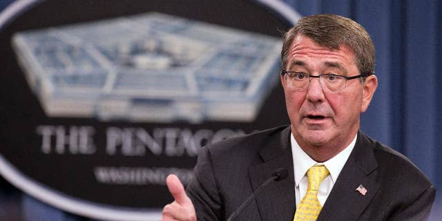 FILE - In this Aug. 20, 2015 file photo, Defense Secretary Ash Carter speaks during a news conference at the Pentagon. Carter spoke with his Russian counterpart Friday, the first step in direct military talks proposed by Russia about Moscow's military buildup to support the Syrian government against the Islamic State group. (AP Photo/Manuel Balce Ceneta, File)