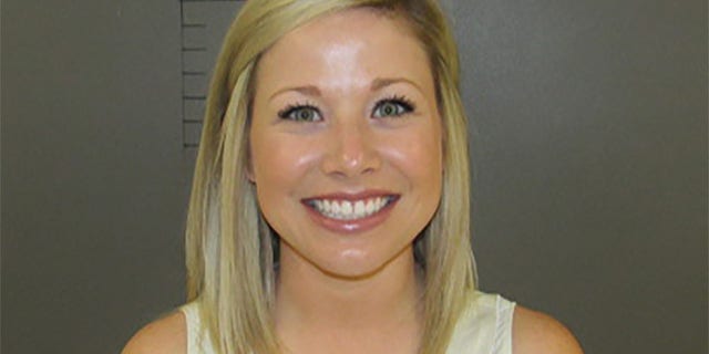 Married Texas teacher Sarah Fowlkes couldn’t wipe the smile off her face for her mugshot after being accused of romping with a 17-year-old student