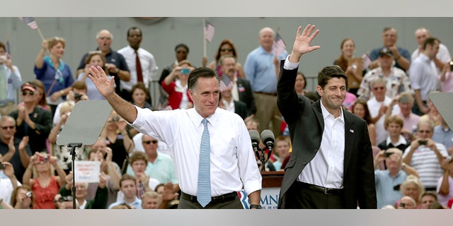 NORFOLK, VA - AUGUST 11: Republican presidential candidate, former Massachusetts Gov. Mitt Romney (L) announces Rep. Paul Ryan (R-WI) (R) as his running mate in front of the USS Wisconsin August 11, 2012 in Norfolk, Virginia. Ryan, a seven term congressman, is Chairman of the House Budget Committee and provides a strong contrast to the Obama administration on fiscal policy. (Photo by Win McNamee/Getty Images)