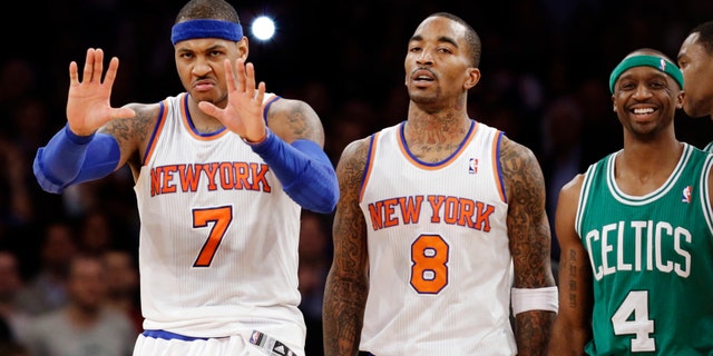 Boston Celtics guard Jason Terry (4) smiles as New York Knicks forward Carmelo Anthony (7) gestures to a referee and guard J.R. Smith (8) walks away after a play in the second half of their NBA basketball game at Madison Square Garden in New York, Monday, Jan. 7, 2013. The Celtics won 102-96. (AP Photo/Kathy Willens)