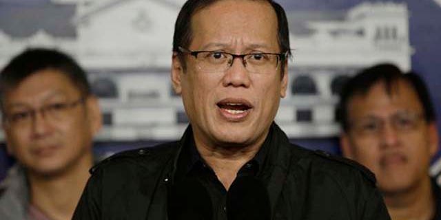 January 8, 2012: Philippine President Benigno Aquino III, center, talks during a hastily called press conference at the Malacanang palace in Manila, Philippines.