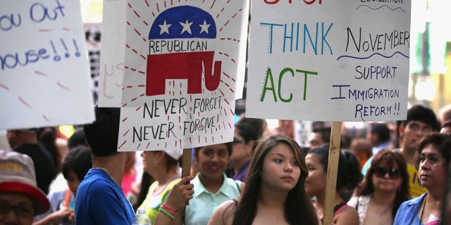 CHICAGO, IL - JUNE 27: Protestors demonstrate calling for immigration reform in front of the Illinois GOP headquarters on June 27, 2013 in Chicago, Illinois. Today the U.S. Senate passed an immigration reform bill with broad bipartisan support that would overhaul immigration laws for the first time in more than two decades. (Photo by Scott Olson/Getty Images)