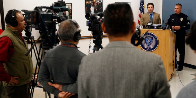 Kennewick Police Sgt. Ken Lattin, right, and Franklin County Prosecutor Shawn Sant, left, speak to members of the media during a Special Investigation Unit briefing Thursday, Feb. 19, 2015 at the Kennewick Police Department regarding the Pasco police shooting earlier this month. (AP Photo/The Tri-City Herald, Sarah Gordon)