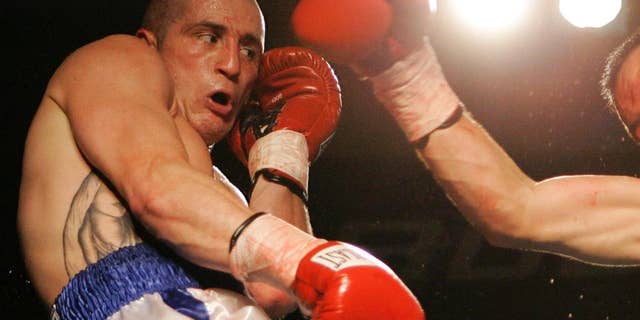 FILE - In this Nov. 22, 2006, file photo, Jesus Francisco Zepeda, of Mexico, misses with a right to Paul Spadafora, left, during their boxing bout in Erie, Pa. Spadafora is in jail again, this time for allegedly stabbing his brother Wednesday, Dec. 21, 2016, during an argument and then fighting with police officers called to intervene, according to a criminal complaint. (AP Photo/Keith Srakocic, File)