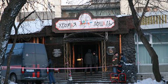 Dec. 5: Russian police officers guard outside a nightclub in Perm, Russia.