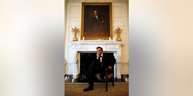 Actor Fritz Klein of Springfield, Illinois poses in the State Dining Room under a painting of President Abraham Lincoln as part of the haunted White House Halloween tours in Washington, October 28, 2016.
