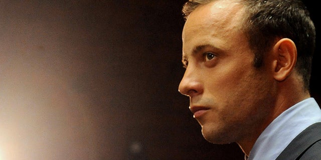 FILE - In this photo taken Friday, Feb. 26, 2013 file photo, Olympic athlete, Oscar Pistorius appears in court for his bail hearing after being charged with the shooting of his girlfriend, Reeva Steenkamp, in Pretoria, South Africa. Oscar Pistorius and Caster Semenya have been left off a list of athletes to receive funding by the South African Olympic Committee ahead of the 2016 Rio Games. South African Sports Confederation and Olympic Committee chief executive Tubby Reddy says Pistorius wasn't included on the Operation Excellence support program because of his decision not to compete this year to concentrate on his murder trial. He's accused of shooting his girlfriend. (AP Photo/Themba Hadebe, File)