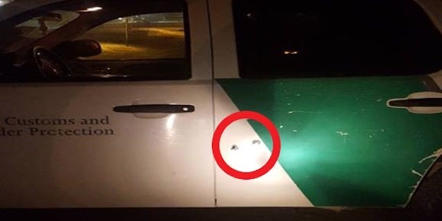 U.S. Customs and Border Protection San Diego tweeted out this image of bullet holes in the side of an agent's SUV.