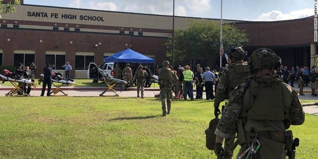 Law enforcement officers respond to Santa Fe High School following a shooting incident in this Harris County Sheriff office, Santa Fe, Texas, U.S., photo released on May 18, 2018.