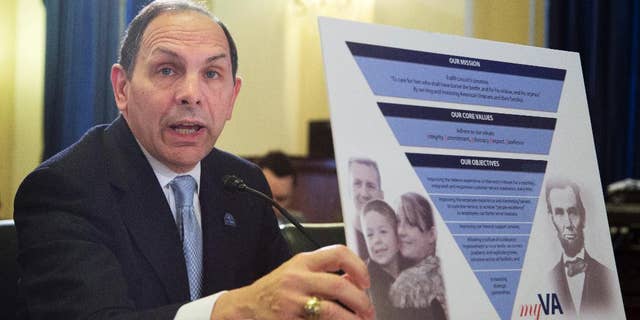 Veterans Affairs Secretary Robert McDonald holds a chart as he testifies on Capitol Hill in Washington, Wednesday, Feb. 11, 2015, before the House Veterans' Affairs Committee hearing on the Veterans Affairs budget. (AP Photo/Manuel Balce Ceneta)