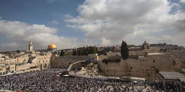 Jewish men of the Cohanim Priestly caste participate in a blessing during the holiday of Sukkot, in front of the Western Wall, the holiest site where Jews can pray in Jerusalem's Old City, in October 2016.