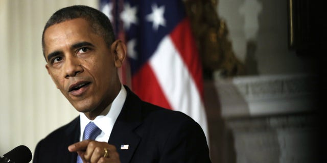 WASHINGTON, DC - OCTOBER 17: U.S. President Barack Obama makes a statement at the State Dining Room of the White House October 17, 2013 in Washington, DC. Obama said the American people are completely fed up with Washington and called on cooperation to work things out. (Photo by Alex Wong/Getty Images)