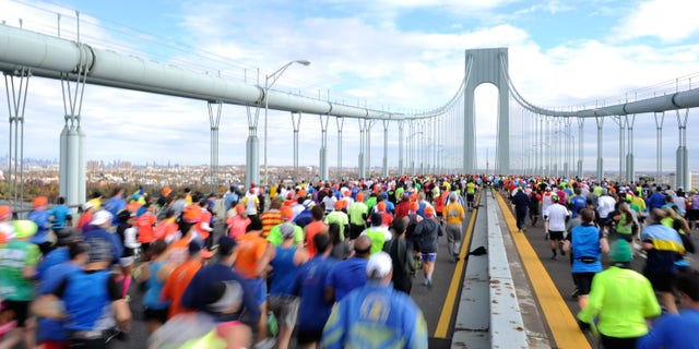 Runners cross the Verrazano-Narrows Bridge at the start of the ING New York City Marathon, Nov. 3, 2013.