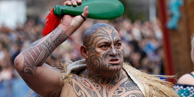 A Maori warrior performs during an official welcome ceremony for the Rugby World Cup in Auckland.