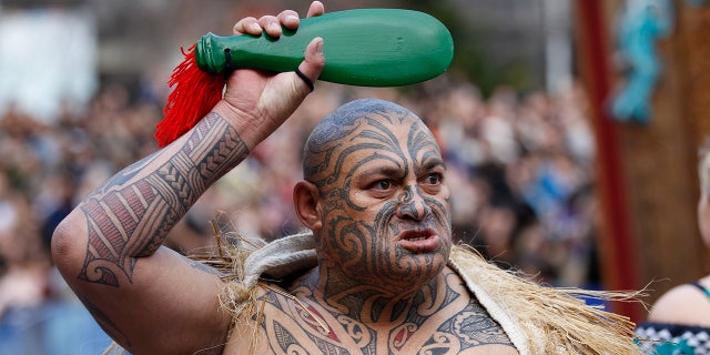 A Maori warrior performs during an official welcome ceremony for the Rugby World Cup in Auckland.