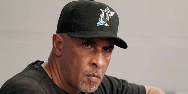 In this June 6, 2011, photo, Florida Marlins manager Edwin Rodriguez watches from the dugout during a baseball game against the Milwaukee Brewers in Miami. Rodriguez, the first Puerto Rican-born manager in major league history, unexpectedly resigned Sunday, June 19, 2011. after less than one year on the job. (AP Photo/Lynne Sladky)