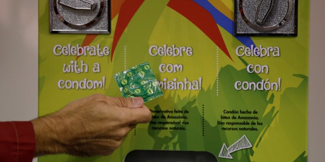 A condom dispenser is seen at the 2016 Rio Olympics Village in Rio de Janeiro. This year, a total of 110,000 condoms will be distributed at the Winter Olympics in South Korea, translating to about 37.6 contraceptives per athlete.