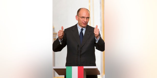 French President Francois Hollande, right, listens to Italy's Prime Minister Enrico Letta during a press conference at the Elysee Palace in Paris, Wednesday, May 1, 2013. (AP Photo/Jacques Brinon)