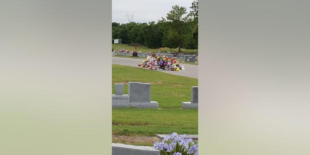 The flags were seen in a giant pile on the ground at Bixby Cemetery in Oklahoma.
