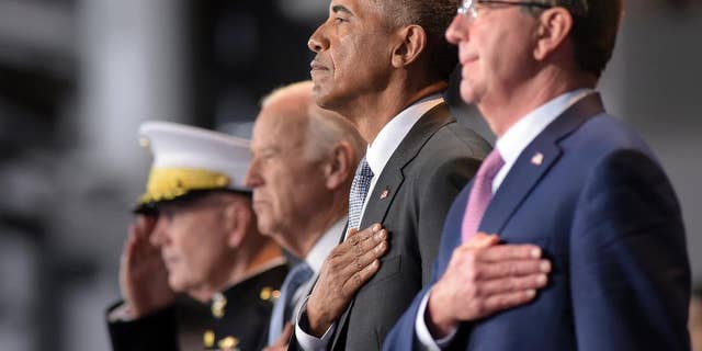 President Barack Obama, stands with, from left, Joint Chiefs Chairman Gen. Joseph Dunford, Vice President Joe Biden, and Defense Secretary Ash Carter, as they listen to the National Anthem during an Armed Forces Full Honor Farewell Review for the president, Wednesday, Jan. 4, 2017, at Conmy Hall, Joint Base Myer-Henderson Hall, Va. (AP Photo/Susan Walsh)