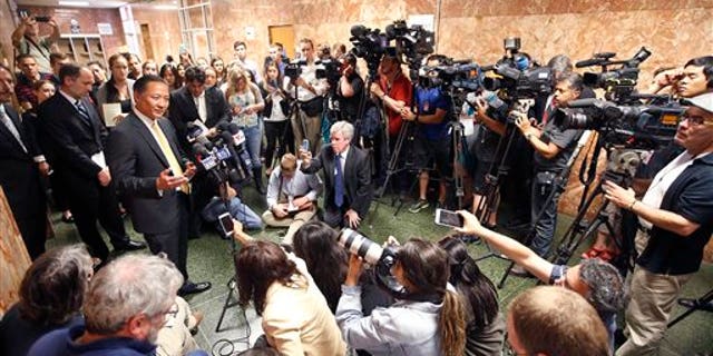 San Francisco Public Defender Jeff Adachi, left, talks to members of the media after Francisco Sanchez's arraignment Tuesday, July 7, 2015, in San Francisco.