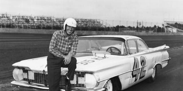 DAYTONA BEACH, FL - FEBRUARY 22: Lee Petty driver of the #42 Oldsmobile poses in front of his car before the first 1959 Winston Cup Daytona 500 race at the Daytona International Speedway on February 22, 1959 in Daytona Beach, Florida. He would win the first Daytona 500. (Photo by ISC Archives via Getty Images)