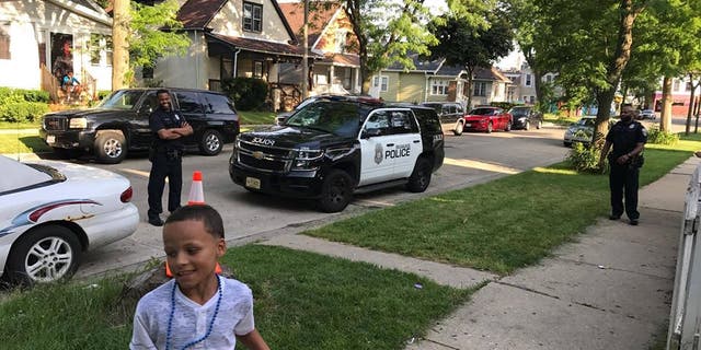 Jordan McClelland and Milwaukee Police Officers playing 'cans.'