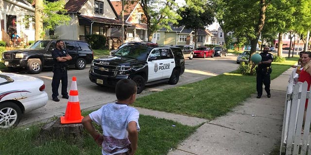 Jordan McClelland and Milwaukee Police Officers playing 'cans.'