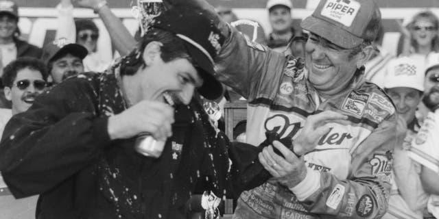 DAYTONA BEACH, FL - FEBRUARY 14: Bobby Allison driver of the #12 Buick celebrates with his son Davey (Feb 25, 1961-July 13, 1993) driver of the Robert Yates Racing #28 Texaco-Havoline Ford after winning the 1988 NASCAR Winston Cup Daytona 500 at the Daytona International Speedway on February 14, 1988 in Daytona Beach, Florida. (Photo by ISC Archives via Getty Images)