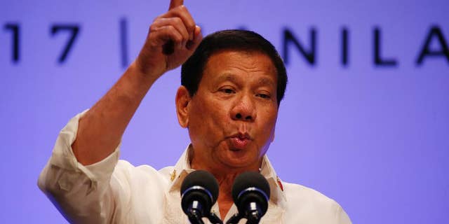 Philippines President Rodrigo Duterte gestures while addressing the media following the conclusion of the 30th ASEAN Leaders' Summit in Manila, Philippines, Saturday, April 29, 2017. Duterte suggested Saturday to his American counterpart to back out from an intensifying standoff with North Korea not in surrender but to avoid risking a nuclear "holocaust" that could affect Asia immensely. (AP Photo/Bullit Marquez)